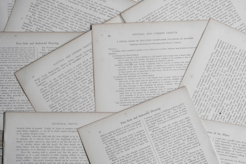 Printed filings spread across a desk