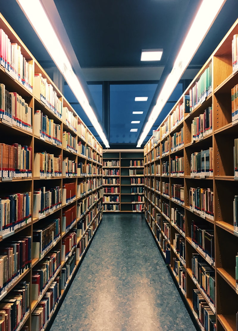 Wooden bookcases lining a library hall